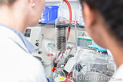 Scientists preparing experiment in research lab Stock Photo