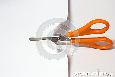 Scissor cutting white paper Stock Photo