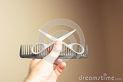 Scissors comb various tools in hand Stock Photo