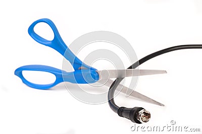 Scissors cutting through a coaxial RG6 cable Stock Photo