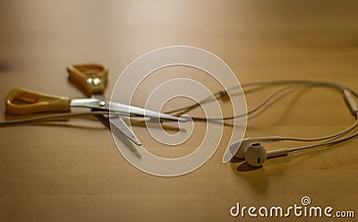 Scissors cutting headphones cord Stock Photo