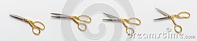 Scissors gold and silver isolated against white background Stock Photo