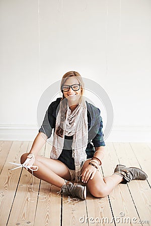 Scissors, portrait of happy woman and puppet strings for freedom on floor of home, house or apartment. Marionette, smile Stock Photo