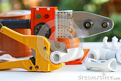 Scissors and soldering iron for welding polypropylene pipes Stock Photo