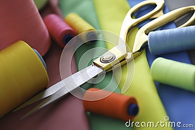 Scissors thread fabric sewing lie on table business Stock Photo