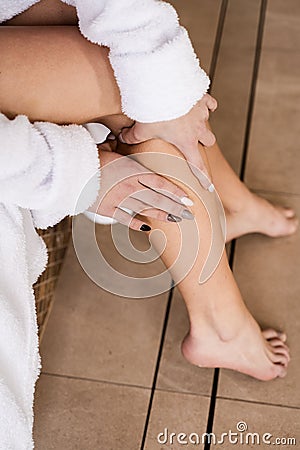 Sclerotherapy procedure at visiting vascular surgeon doctor. Deep vein thrombosis and varicose of woman. Girl touching Stock Photo