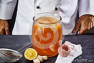 Scoby and starter liquid placed in the black tea Stock Photo