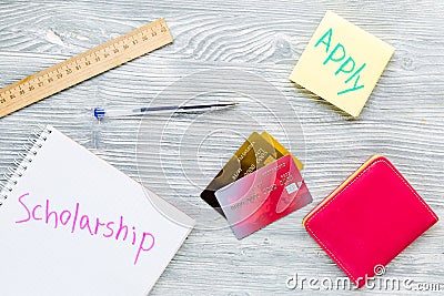 Scolarship apply with credit cards and wallet on white table top view Stock Photo