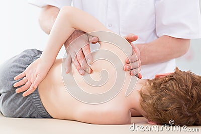 Scoliosis exercises with professional therapist Stock Photo