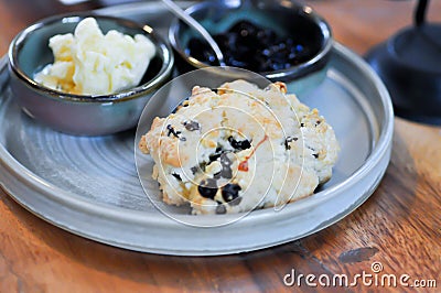 scone , blueberry scone or scone with whipped cream and blueberry dressing Stock Photo