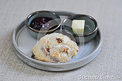 scone , cranberry scone or scone with butter and strawberry dressing Stock Photo