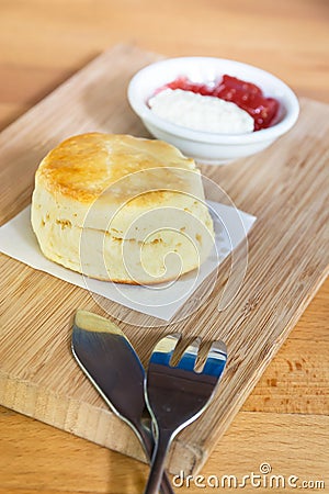 Scone with cream and strawberry jam Stock Photo