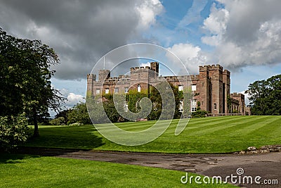 Scone Palace, red sandstone brick castle in Perthshire, Scotland at nice sunny summer weather Stock Photo