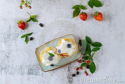 Scones with whipped cream and wildberry Stock Photo