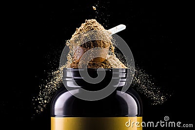 A scoop of chocolate protein powder drink in black plastic container isolated Stock Photo