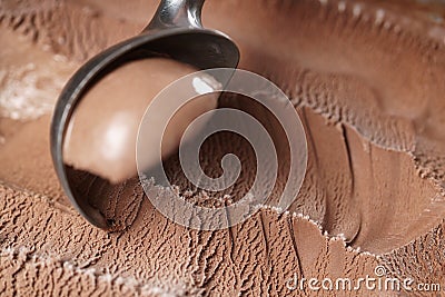 Scooping chocolate ice cream close up shot Stock Photo