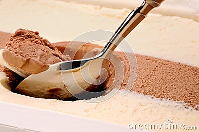 Scooping chocolate and vanilla ice cream Stock Photo