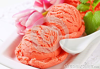 Scoops of fruit sherbet and fresh tulips Stock Photo