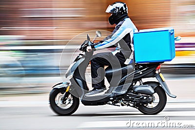 Scooter delivery service in motion blur Stock Photo