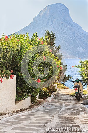 Scooter on narrow Greek Kalymnos island street Stock Photo