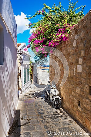 Scooter parked on narrow street of Lindos Rhodes, Greece Editorial Stock Photo