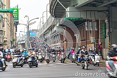 Scooter waterfall in Taiwan. Traffic jam crowded of motorcycles at rush hour on the ramp of Taipei Bridge Editorial Stock Photo