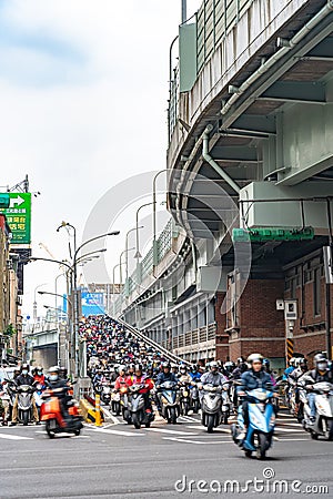 Scooter waterfall in Taiwan. Traffic jam crowded of motorcycles at rush hour on the ramp of Taipei Bridge Editorial Stock Photo