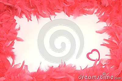 Scope from red feathers with a heart inwardly isol Stock Photo