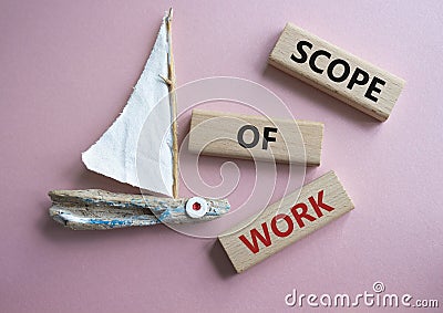Scope of Work symbol. Concept words Scope of Work on wooden blocks. Beautiful pink background with boat. Business and Scope of Stock Photo