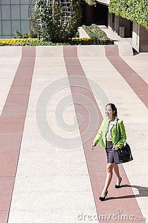 Scort woman with tablet and mobile phone smiling Stock Photo