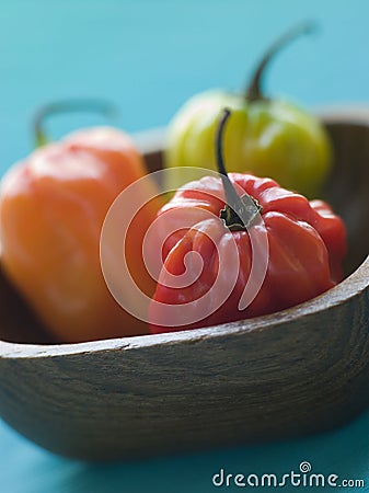 Scotch Bonnet Chilies In a Wooden Dish Stock Photo