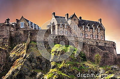 Scotland - Edinburgh Castle with green garden at dramatic sunset, UK Editorial Stock Photo