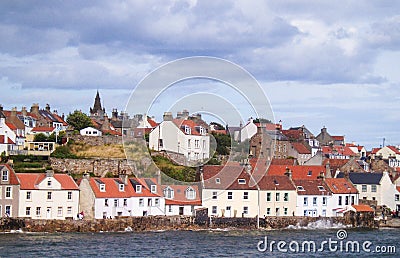 Scotland, Fife coast, village by North Sea, houses slope to sea wall Stock Photo