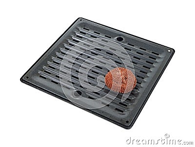 Scouring pad on broiler pan Stock Photo