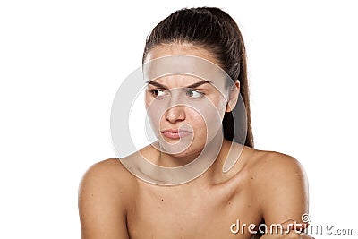 Scowling woman without makeup Stock Photo