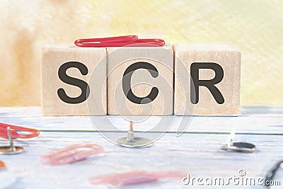 scr signs on wooden cubes on a light background Stock Photo