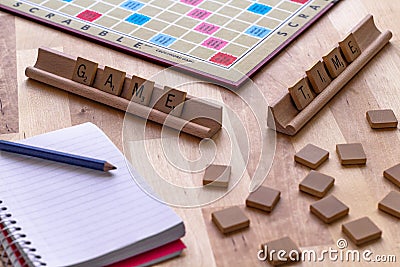 Scrabble board game with the scrabble tile spell `Game Time` Editorial Stock Photo