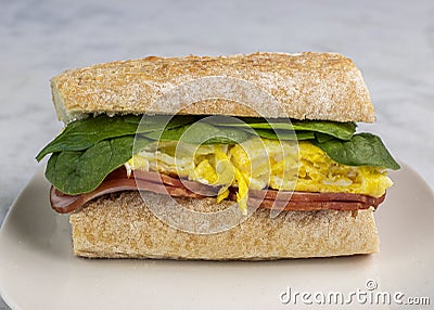 scramble eggs with canadian bacon on ciabatta bread Stock Photo