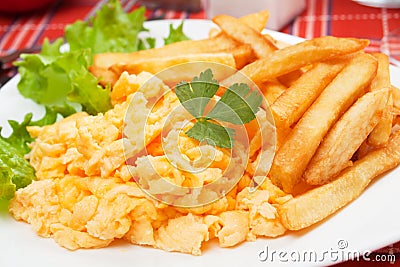 Scrambled egg with french fries Stock Photo