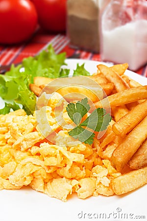 Scrambled egg with french fries Stock Photo