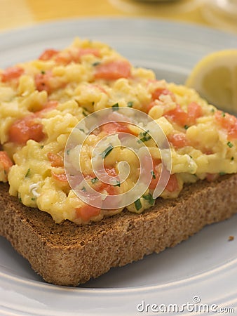 Scrambled Egg and Smoked Salmon on Brown Toast Stock Photo