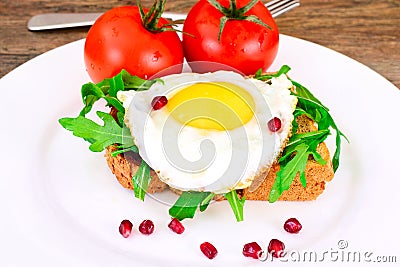 Scrambled Eggs with Arugula on Whole Grain Bread Health Food. Stock Photo