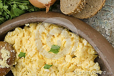 Scrambled eggs and bread Stock Photo