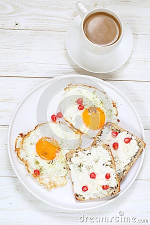 Scrambled eggs with coffee on white background. Scrambled eggs with ricotta sandwiches on white plate Stock Photo