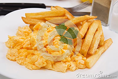 Scrambled eggs with french fries Stock Photo