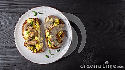 Scrambled eggs French toast with mushrooms, Top view, banner, overhead Stock Photo