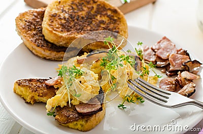 Scrambled eggs with French toast topped with watercress Scrambled eggs with watercress, french toast Stock Photo