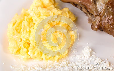Scrambled eggs with grated cheese. Stock Photo