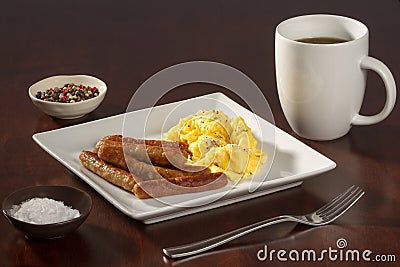 Scrambled Eggs and Link Sausages with Coffee Askew Stock Photo