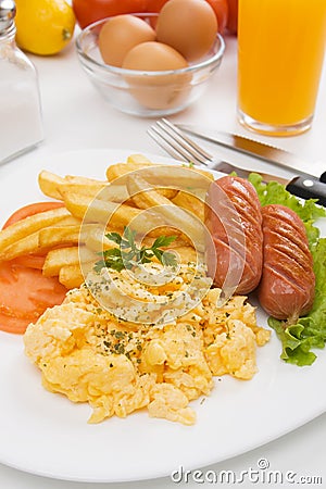 Scrambled eggs with sausage and french fries Stock Photo